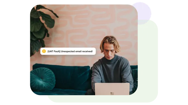 Man on laptop with unexpected email alert